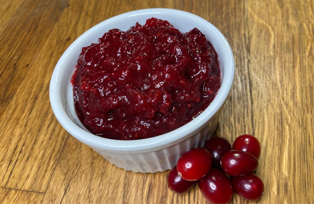 spiced ginger cranberry sauce in a white ramekin